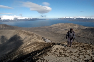 Gary hikes up a slope of volcanic scree, Deception Island