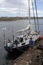 Gary carries a last box of provisions to the boat